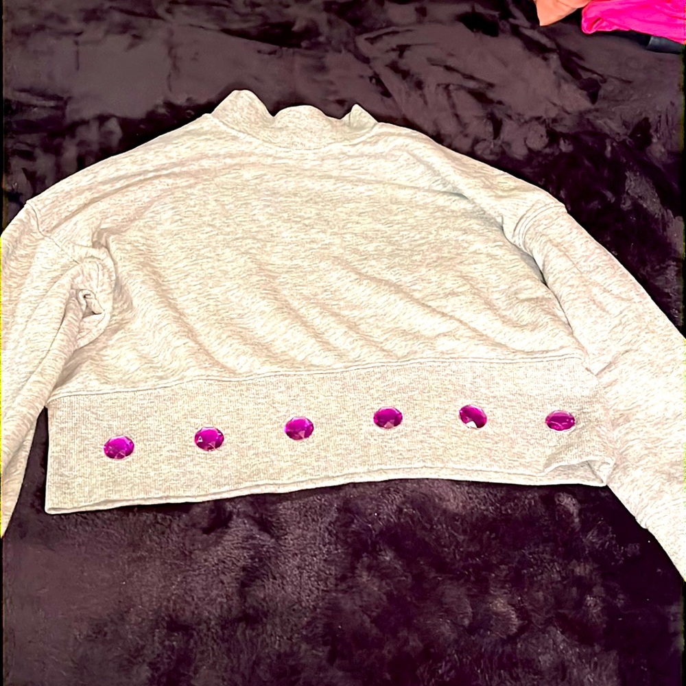 Kids sweatshirt, gray colored embellished with purple round jewels.